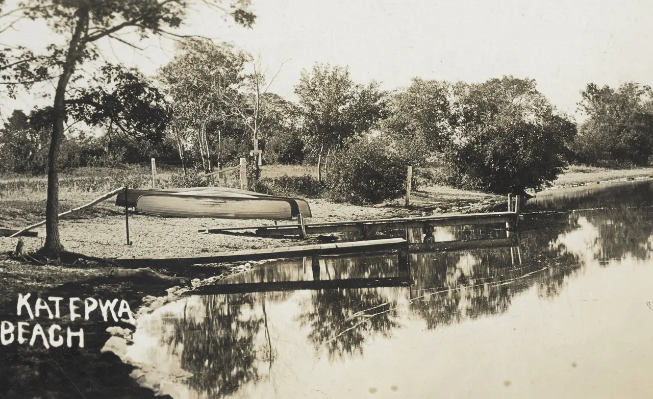 Katepwa Beach with overturned boat and dock, about 1915